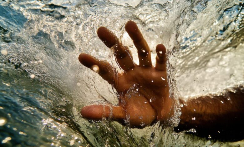 Vecteezy a person s hand is in the water and is being splashed 71014307 1 scaled.jpeg