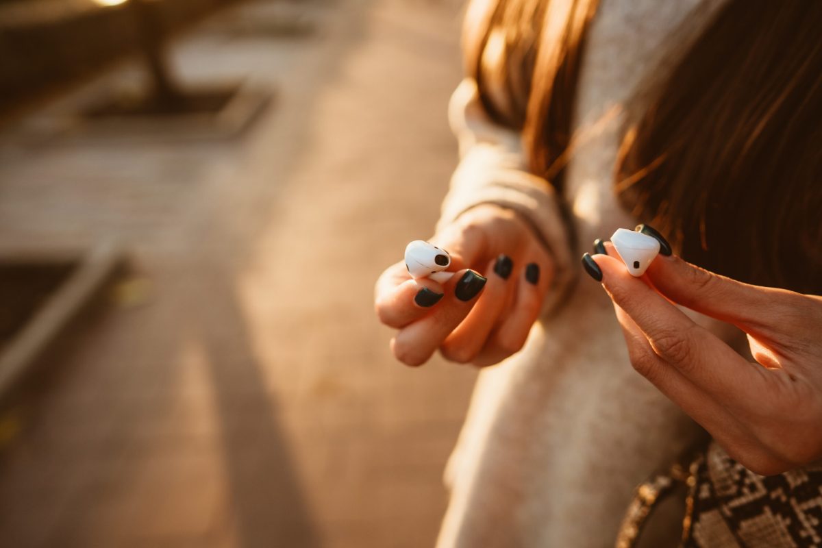 Vecteezy beautiful young girl holding wireless headphones in park 11527182 scaled.jpg