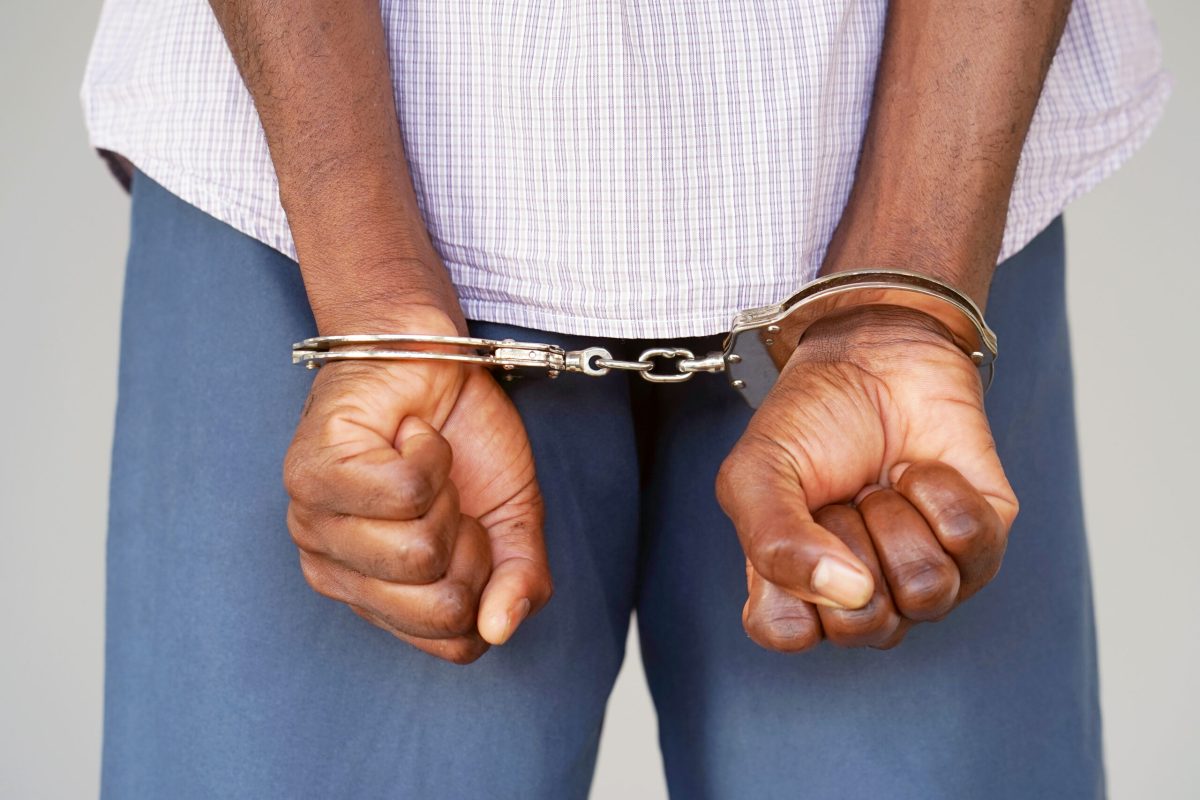 Vecteezy black hands locked in handcuffs close up view 6934437728129 4 scaled.jpg