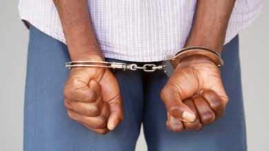 Vecteezy black hands locked in handcuffs close up view 6934437728129 5 scaled.jpg