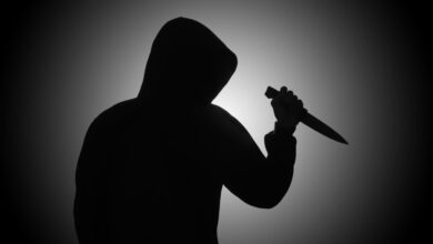 Vecteezy mysterious man wearing black hoodie holding a knife to stab 2410113428229 scaled.jpg