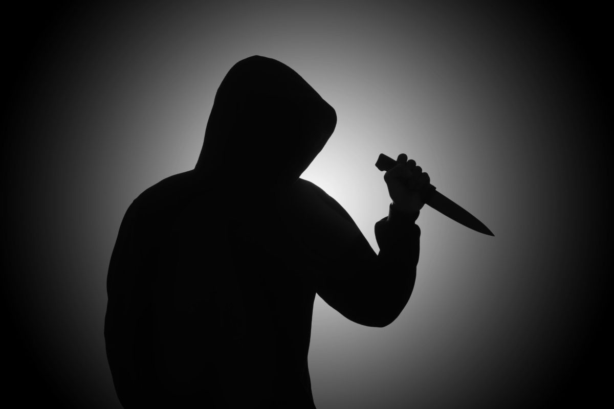 Vecteezy mysterious man wearing black hoodie holding a knife to stab 2410113428229 scaled.jpg