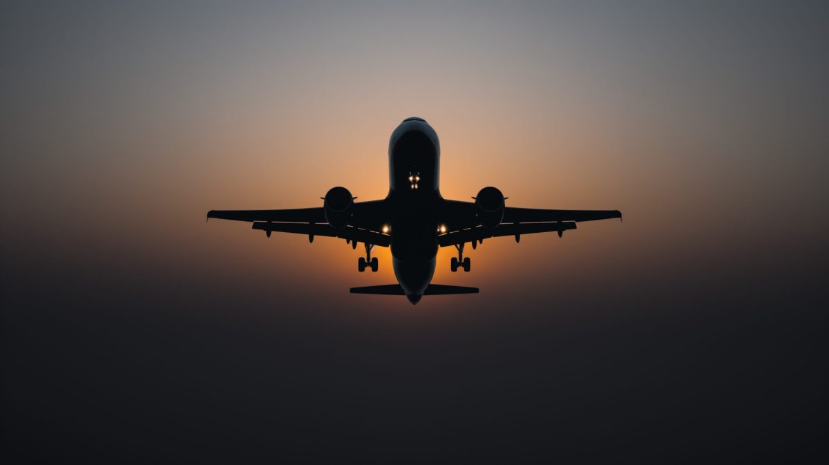 Vecteezy monochrome airplane silhouette against a gradient sunset sky 47717690 scaled.jpg
