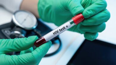Vecteezy gloved hands holding a test tube with a positive hiv blood 6724302 scaled.jpeg