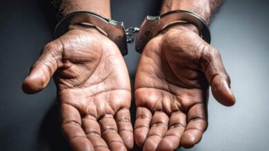 Vecteezy close up of hands in handcuffs 74269454 2 scaled.jpg
