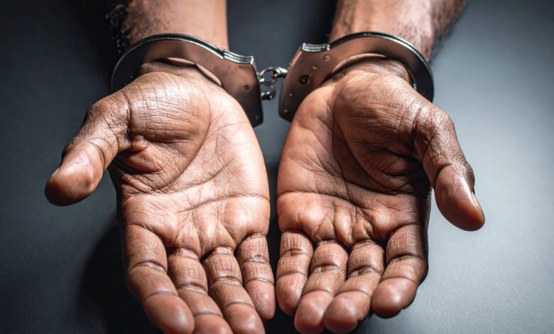 Vecteezy close up of hands in handcuffs 74269454 3 scaled.jpg