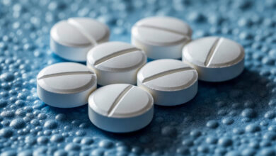 Vecteezy white round tablets arranged on a textured blue surface for 54666777 1 scaled.jpg